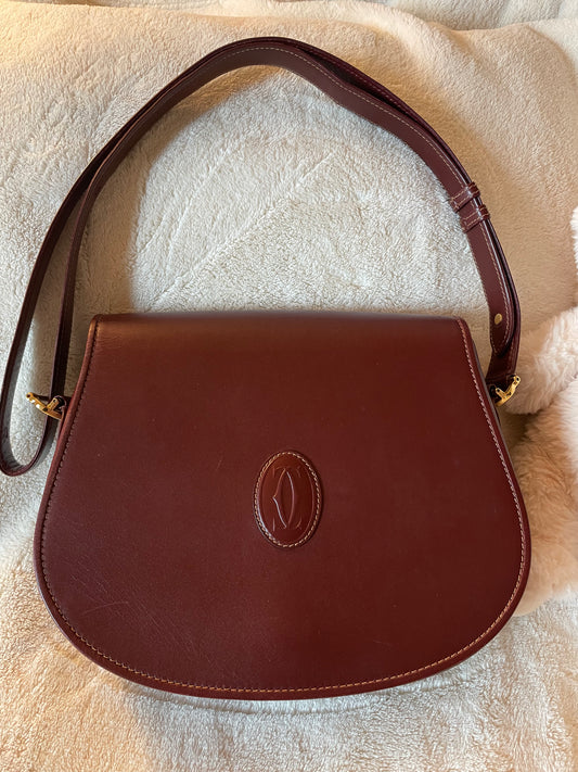 Must de Cartier bordeaux bag